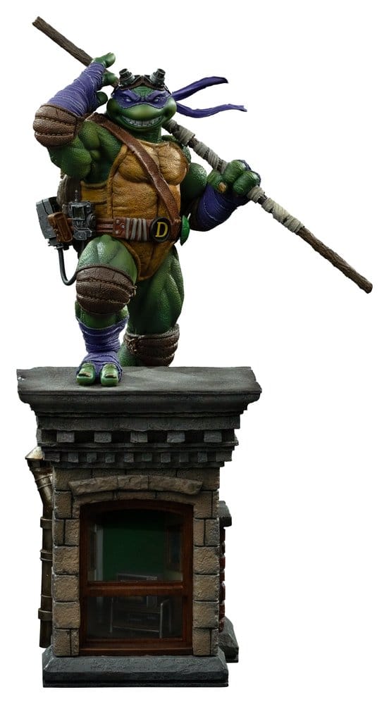 Figurine Donatello Tortues Ninja 1/10 Art Scale Iron Studios, statuette de 32 cm, représentant Donatello en pose dynamique.