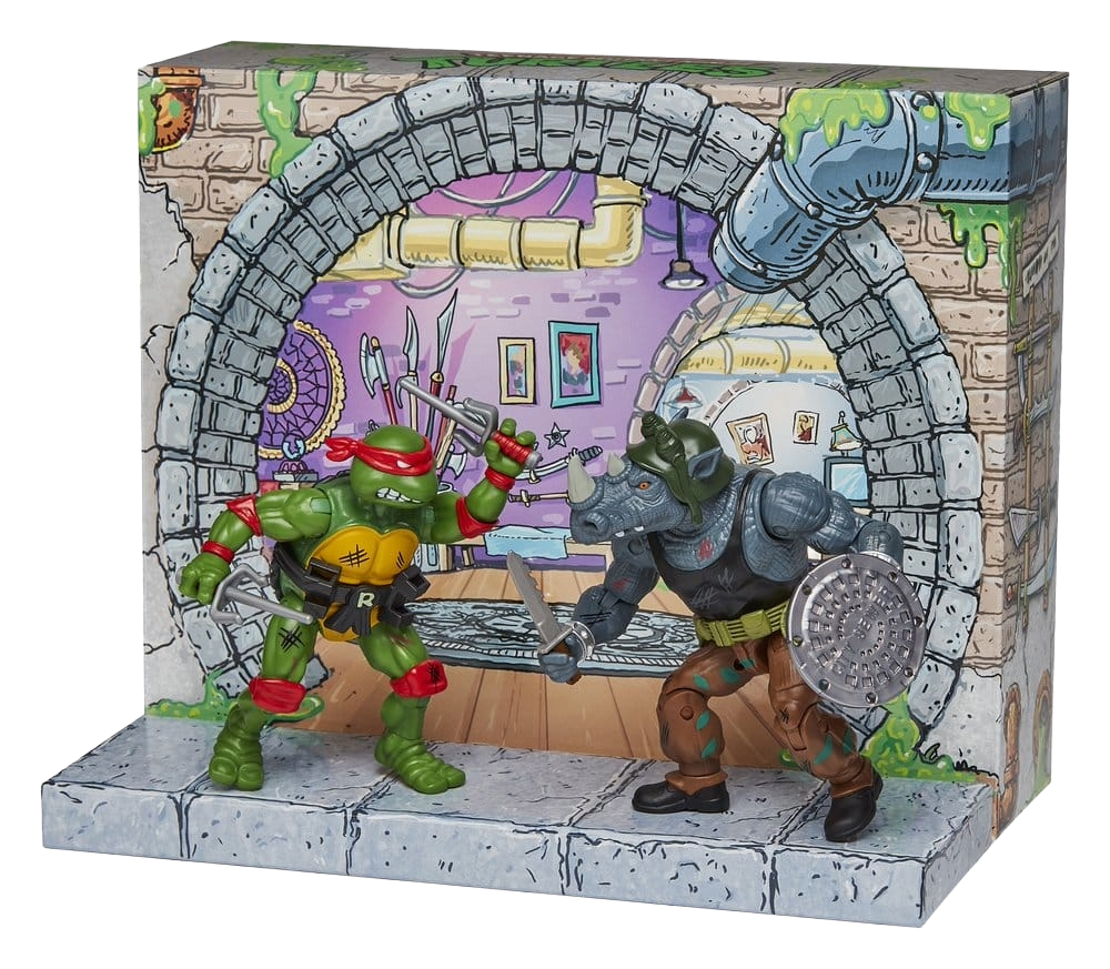 Figurine Tortues Ninja Playmates Toys de Raphael face à Rocksteady, version remasterisée, détails précis et couleurs vives.