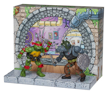 Figurines Tortues Ninja remasterisées de Raphael et Rocksteady de Playmates Toys, détaillées et colorées, pour collection ou jeu.