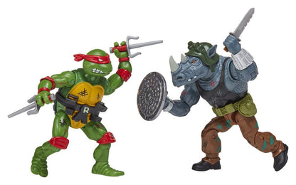 Figurines remasterisées Tortues Ninja Playmates Toys, Raphael et Rocksteady en position de combat.