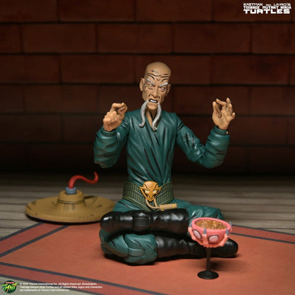 Figurine Neca des Tortues Ninja (Mirage Comics) Foot Mystic Mashima de 18 cm, représentant un personnage en pose dynamique.
